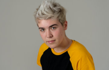 Trans boy posing in cool urban fashion t shirt